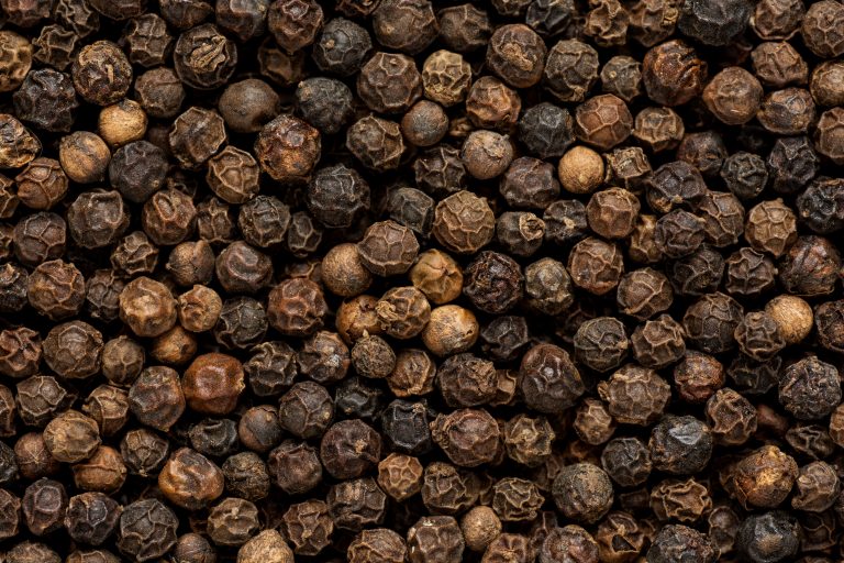 black,pepper,grains,as,background,close,up